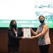 Karen Tham of SJ receiving award