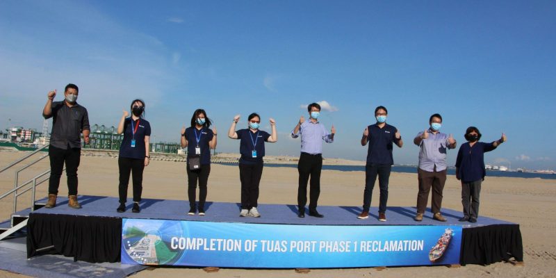 SJ Coastal Engineering team celebrating completion of Tuas Port Phase 1 Reclamation scaled
