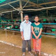 Chicken farmer and family in Cambodia